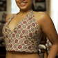 Woman wearing a patterned top in a living room setting